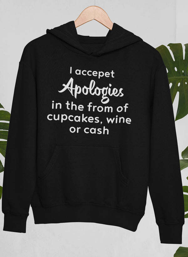I Accept Apologies hoodie in black, front pocket and hood, printed apology message.