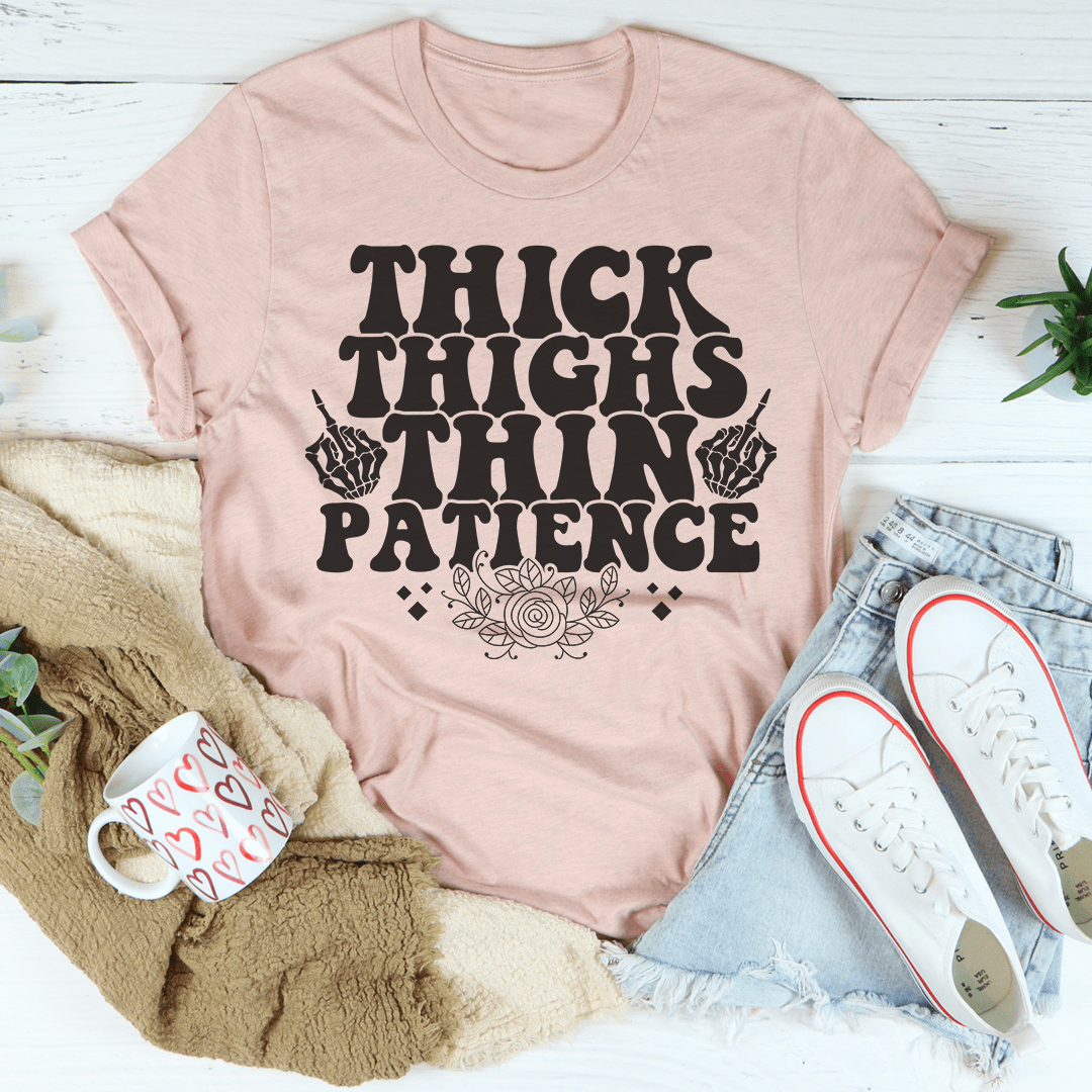 Mauve T-shirt with "THICK THIGHS PATIENCE" graphic and crew neckline