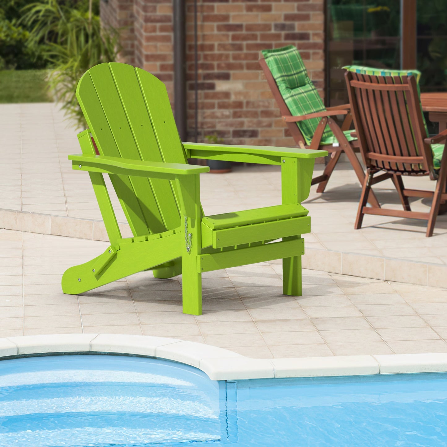 Lime green folding adirondack chair with slatted seat and tall curved backrest
