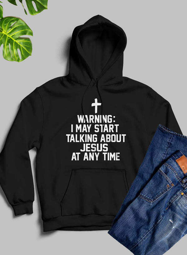 Black pullover hoodie with front pocket, cross icon, and warning text graphic