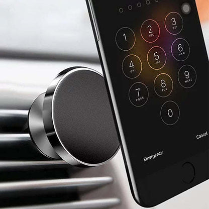 Magnetic phone car mount close-up on air vent clip with circular magnet plate