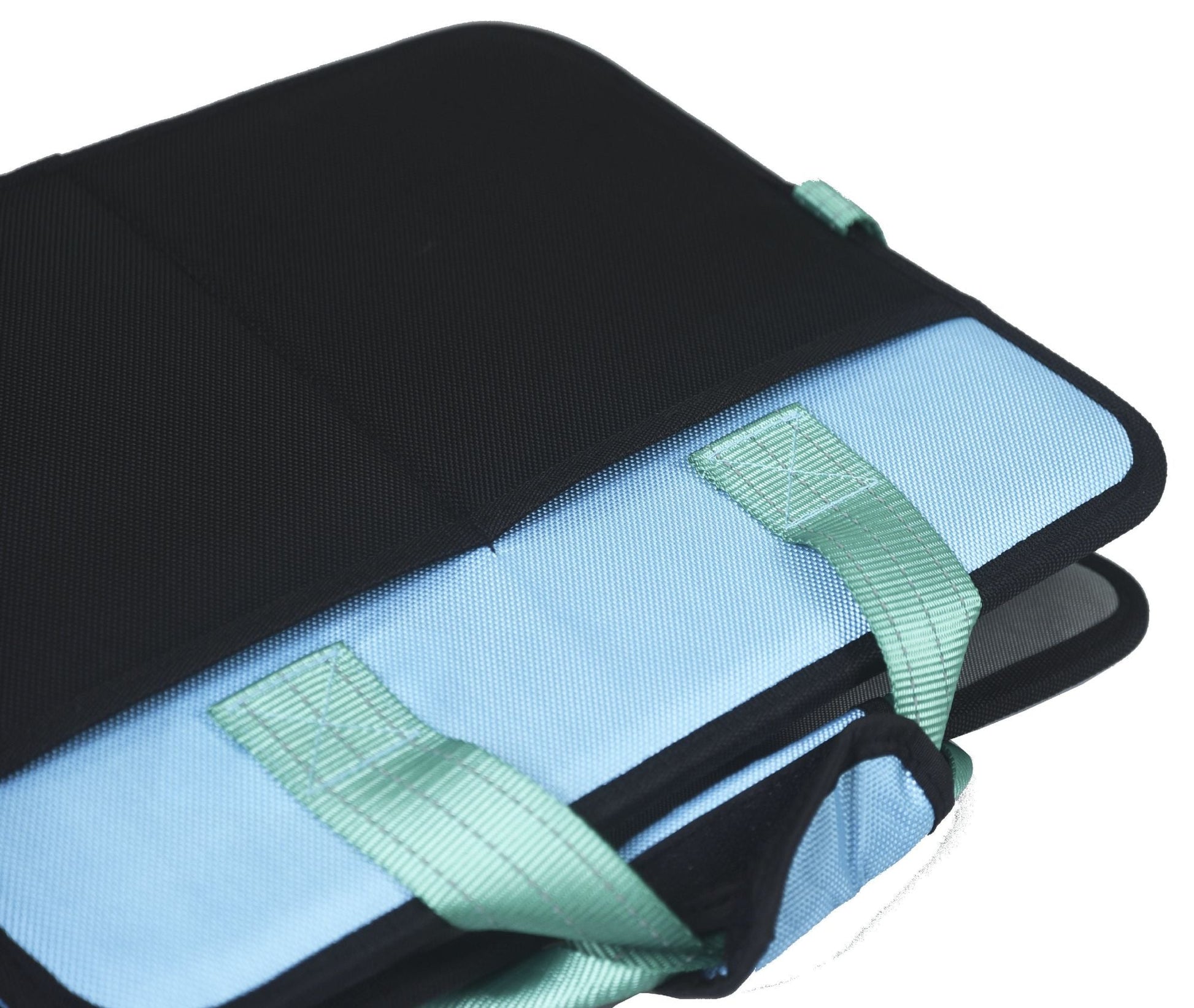 Folded travel pet bed close-up showing light blue strap and black top cover