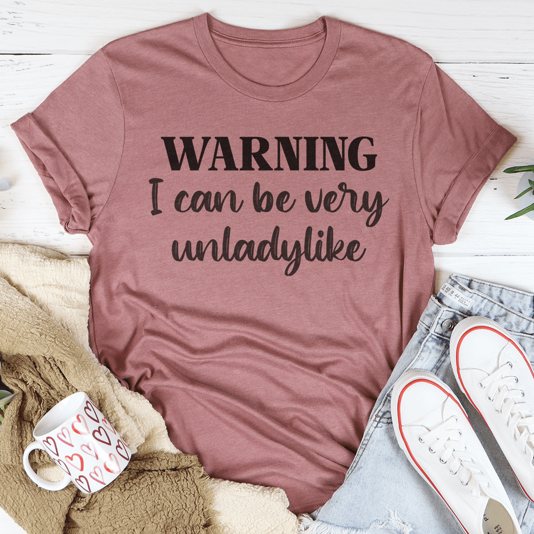 Mauve T-shirt with "WARNING I can be very unladylike" print
