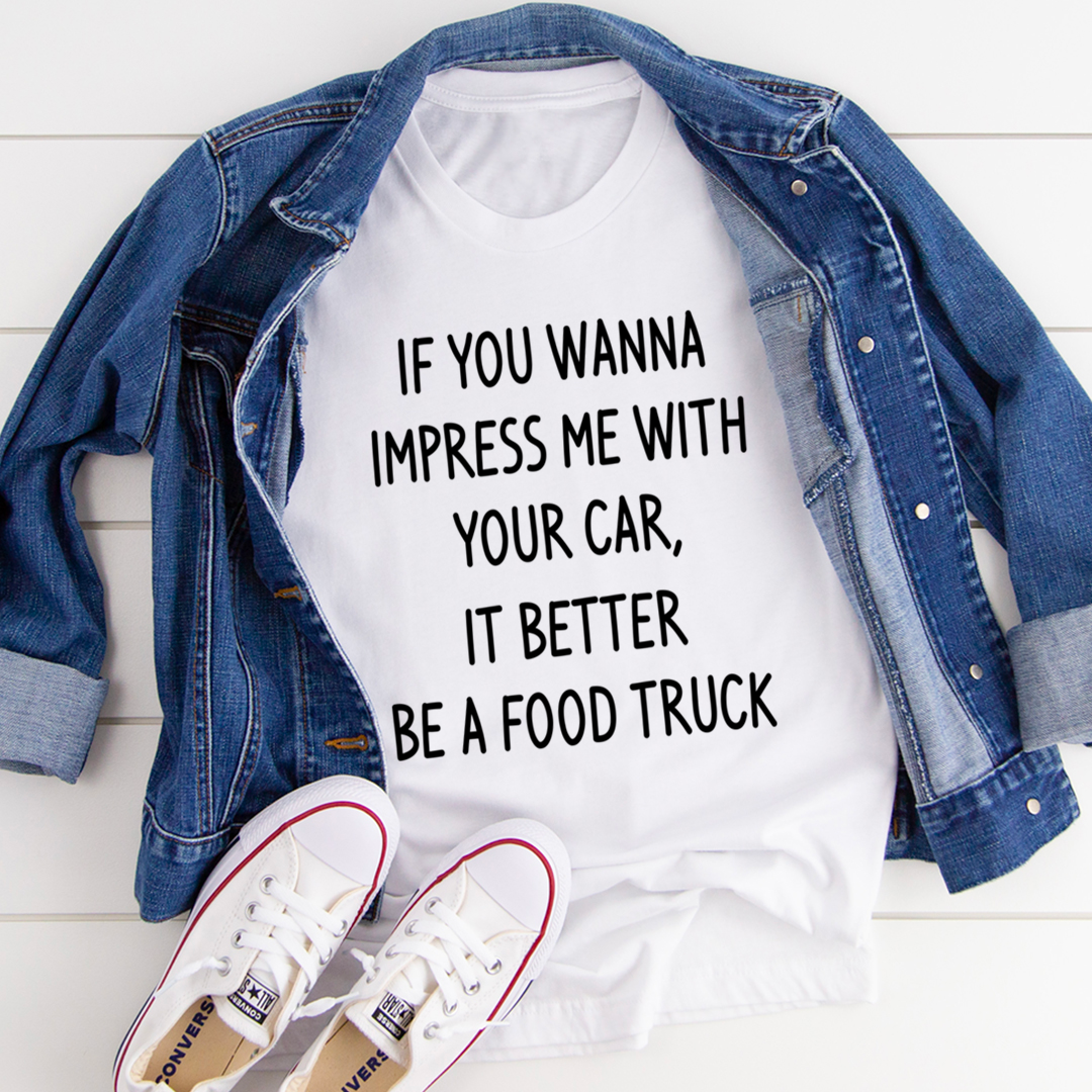 White crew-neck t-shirt under denim jacket, with slogan graphic: "IF YOU WANNA...FOOD TRUCK"