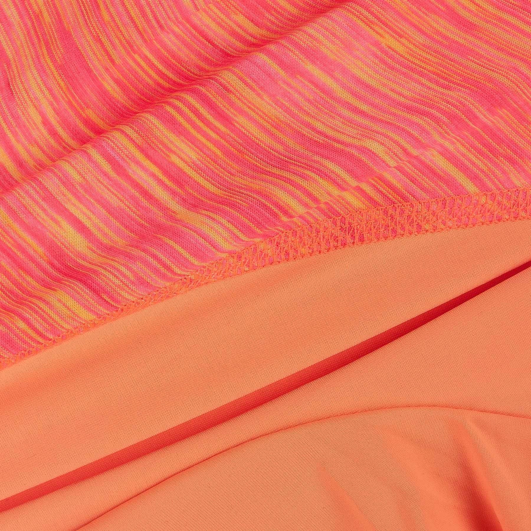 Orange-red heather performance fabric close-up with seam and inner layer panel