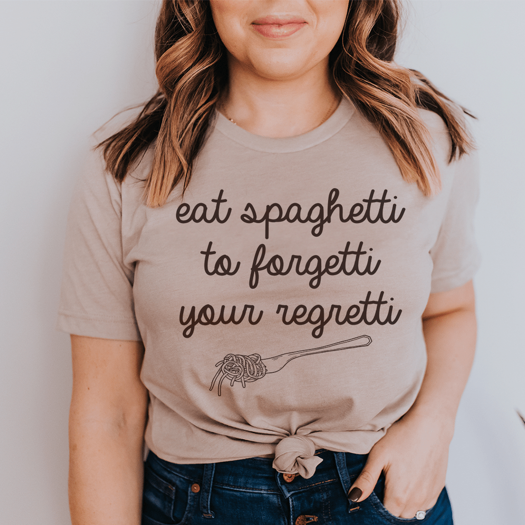Tan crewneck T-shirt with spaghetti quote graphic: eat spaghetti to forgetti your regretti
