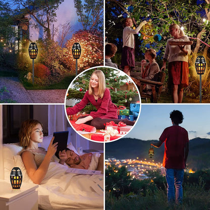 Outdoor LED torch set with black lantern bodies and glowing amber flame-patterns, multiple units.