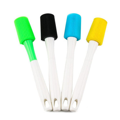Silicone bottle brushes set: green, black, blue, and yellow ribbed heads on white handles
