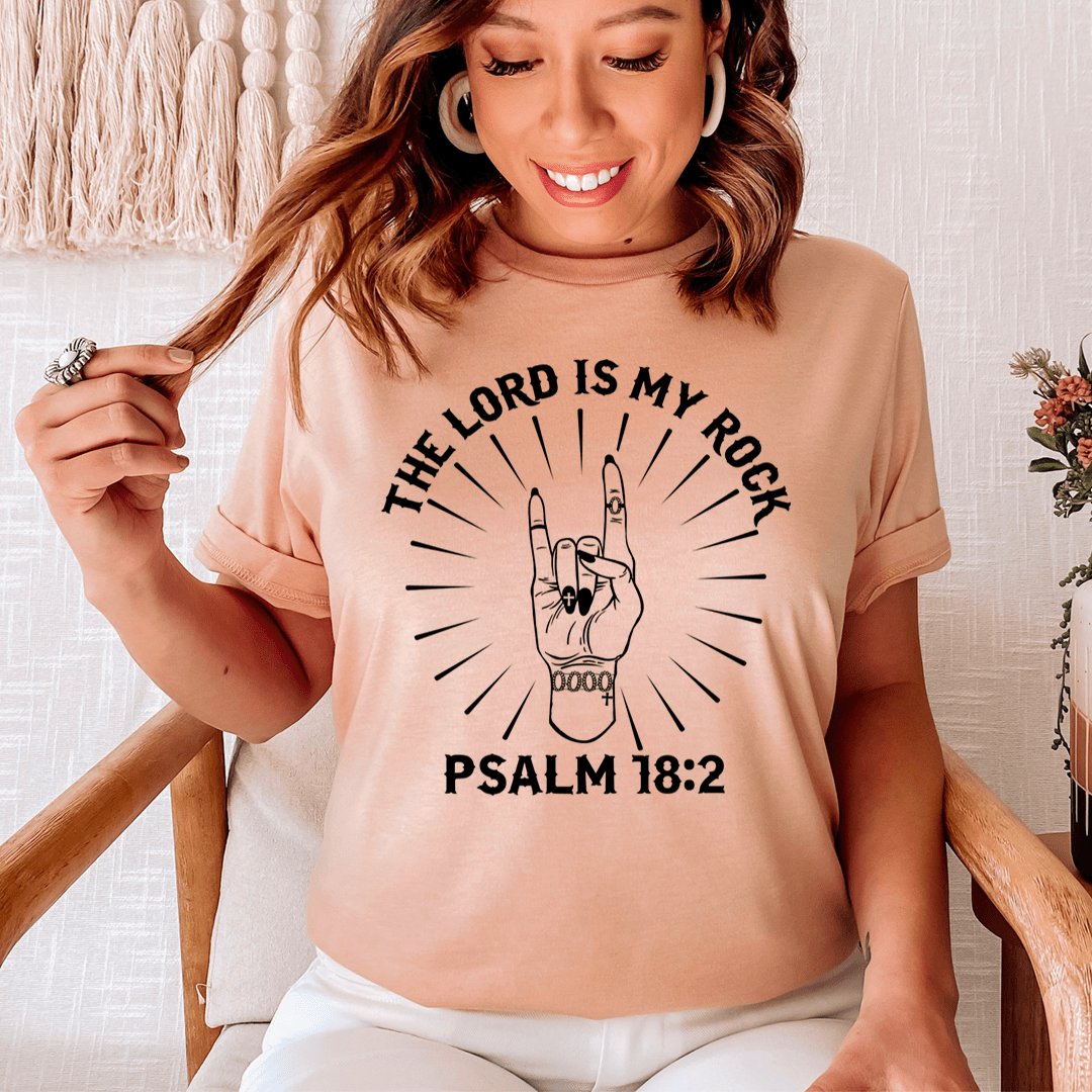 Peach short-sleeve T-shirt with front graphic: “THE LORD IS MY ROCK” and “PSALM 18:2”