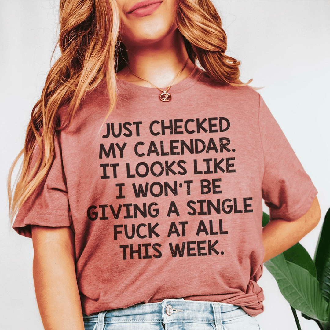 Mauve graphic crew-neck T-shirt worn by model with bold front text