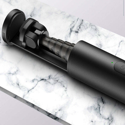 Mini selfie stick close-up of black telescoping arm and control buttons