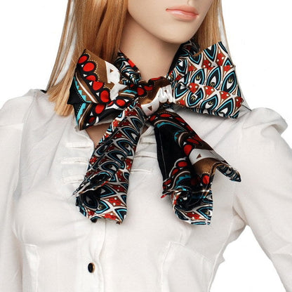 Silk neck scarf with black, red, and teal swirl patterns and white accents
