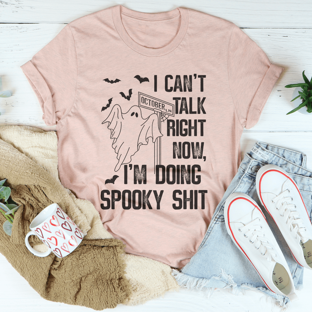Pink heather spooky T-shirt with centered ghost graphic and stacked slogan text