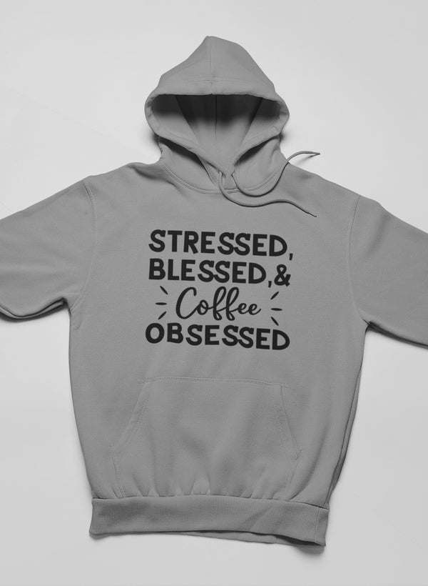 Gray hoodie with hood, front pouch pocket, and “Stressed Blessed & Coffee Obsessed” graphic