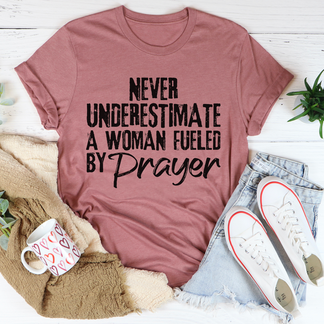 Dusty rose crewneck T-shirt with black 'Never Underestimate' prayer text graphic