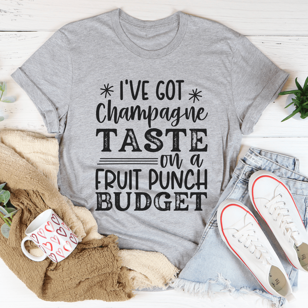 Heather gray T-shirt with front slogan: "I've got Champagne Taste on a Fruit Punch Budget"