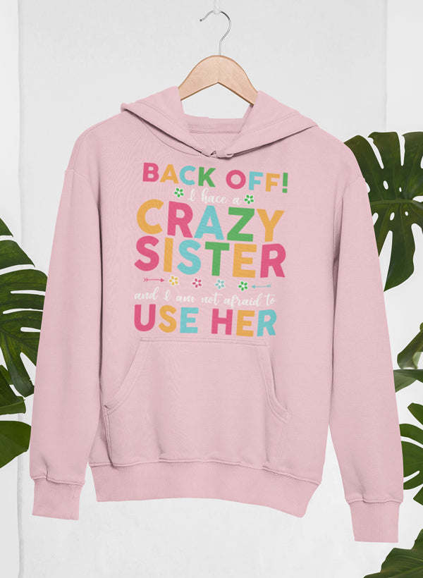 Pink hoodie with colorful 'Back Off! Crazy Sister Use Her' print