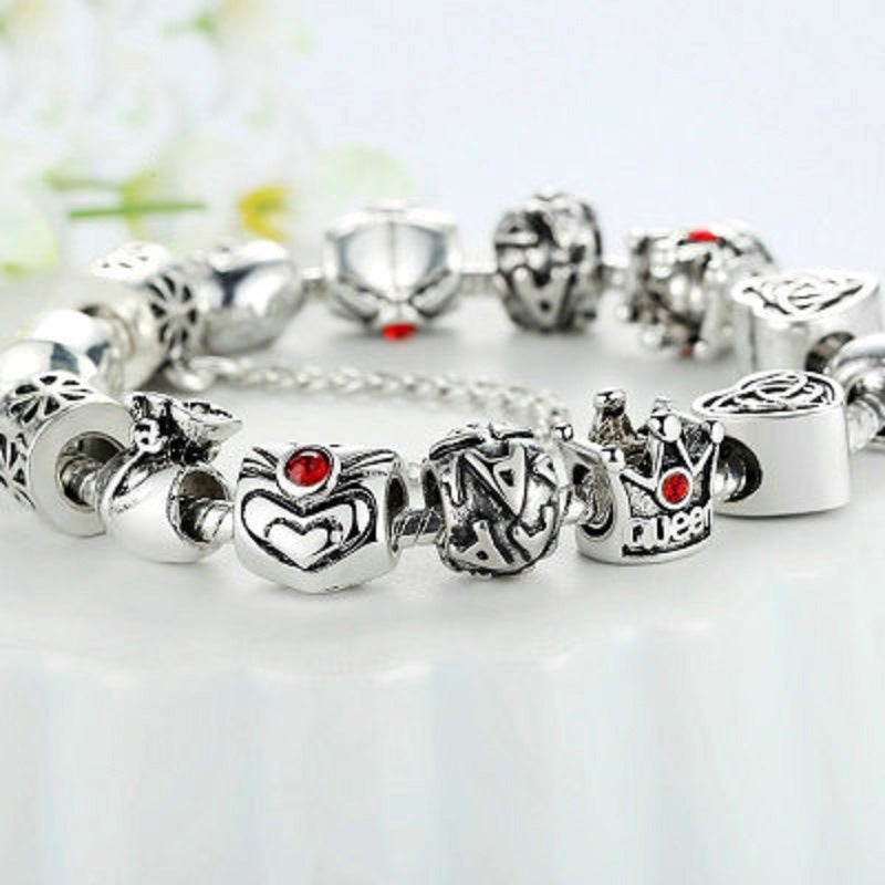 Silver charm bracelet with mixed heart, love and red enamel bead charms on chain