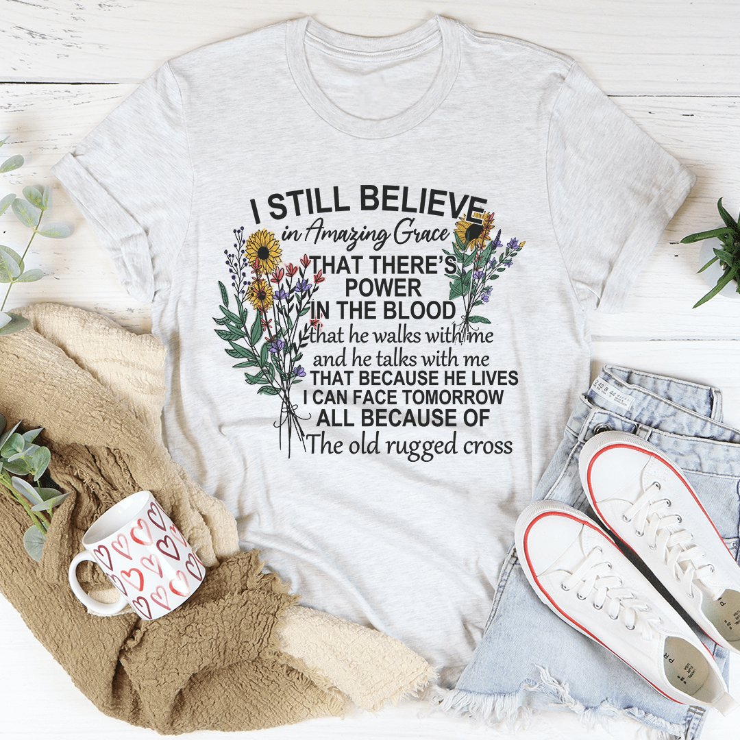 Heather gray crewneck T-shirt with large floral cross graphic and 'I STILL BELIEVE' text