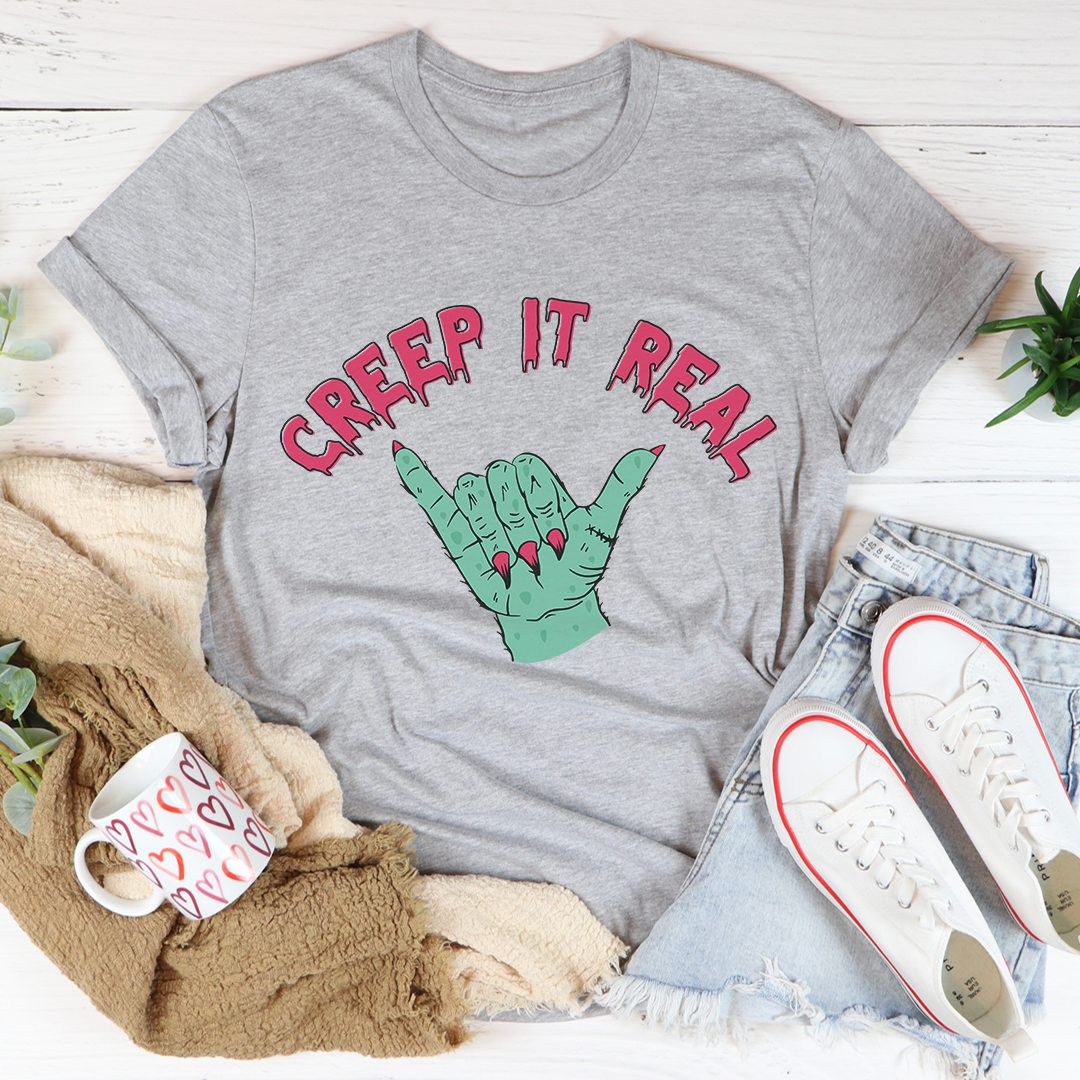 Gray short-sleeve crew-neck T-shirt with “Creep It Real” lettering and green crab illustration
