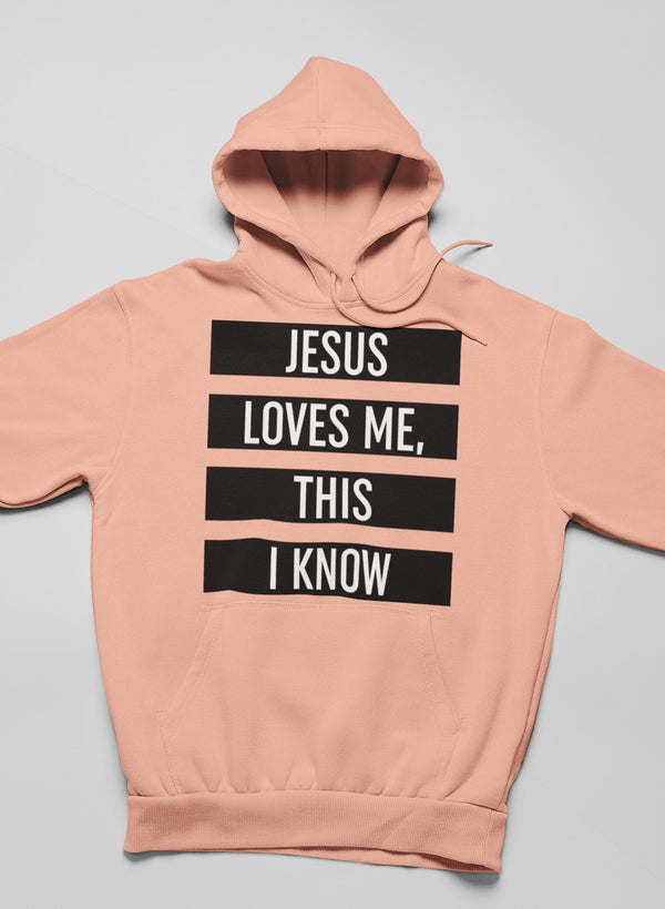 Peach pullover hoodie with black stacked "JESUS LOVES ME THIS I KNOW" graphic