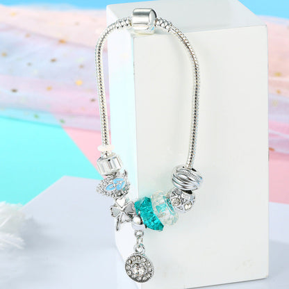 Silver charm bracelet with blue crystal beads and round rhinestone heart dangling charm