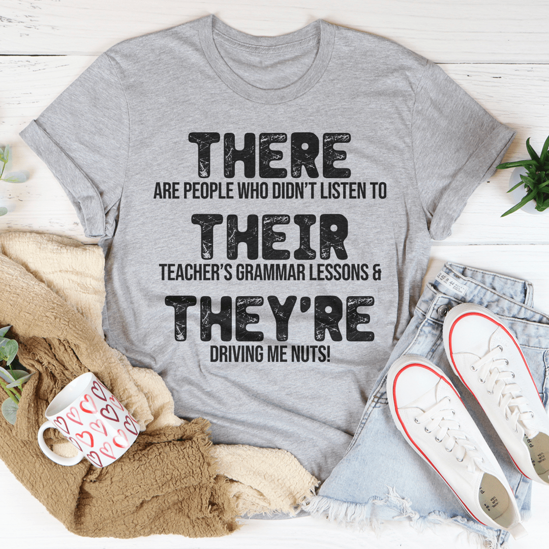 Heather gray T-shirt with 'THERE/THEY'RE' teacher grammar lessons graphic
