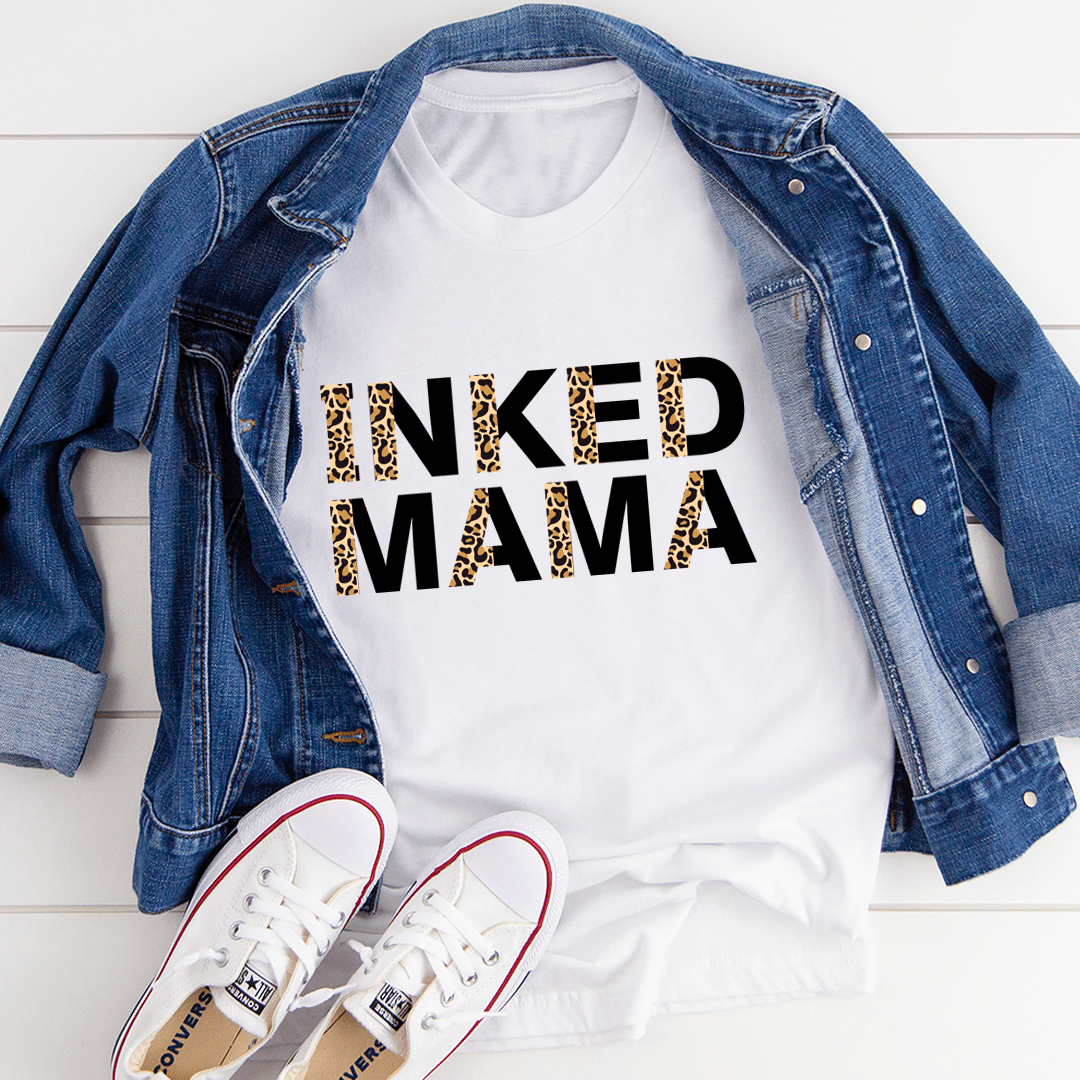 White crew-neck T-shirt featuring large 'Inked Mama' leopard-print graphic, short sleeves