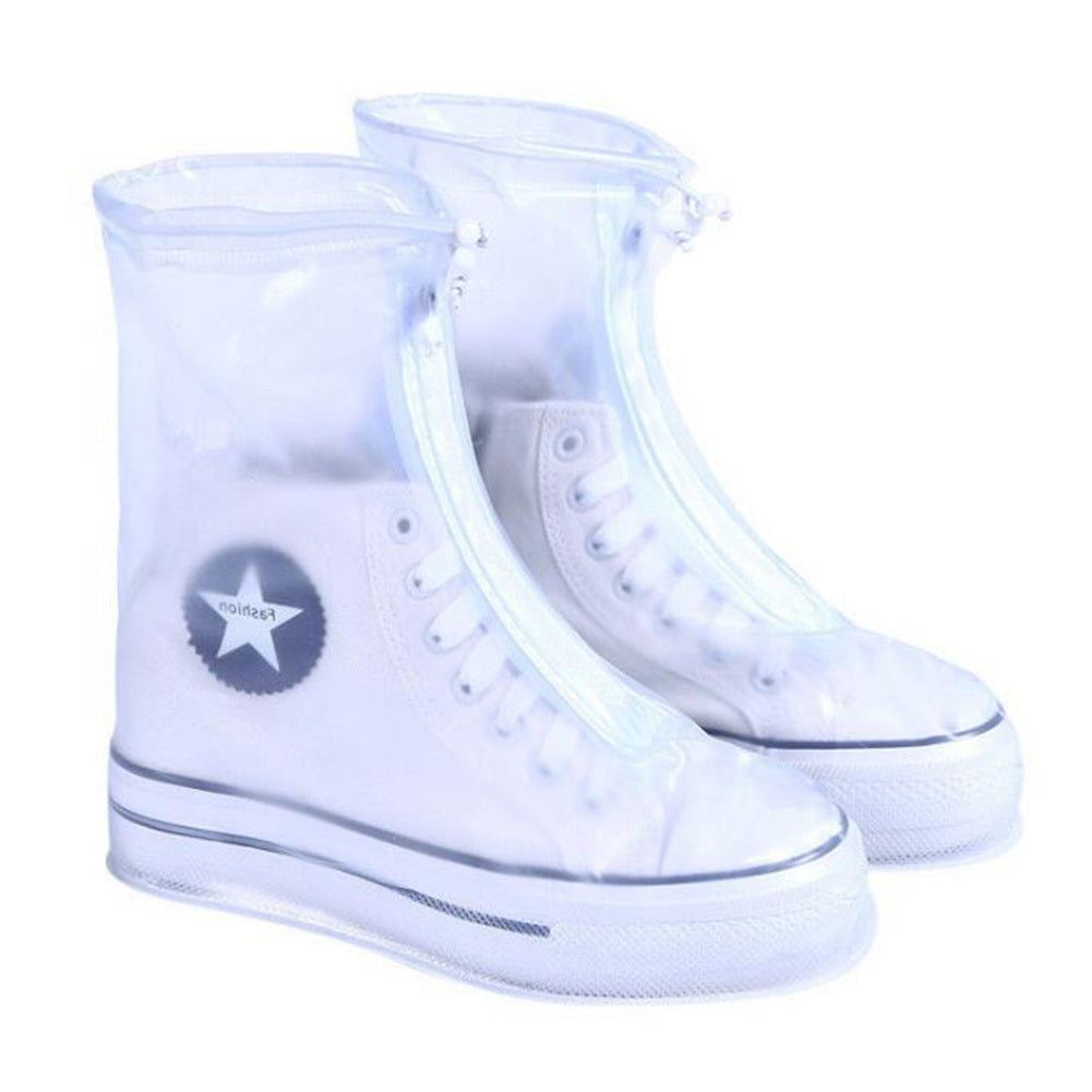 Clear light blue boot covers over lace-up sneakers, ankle-height with drawstring.