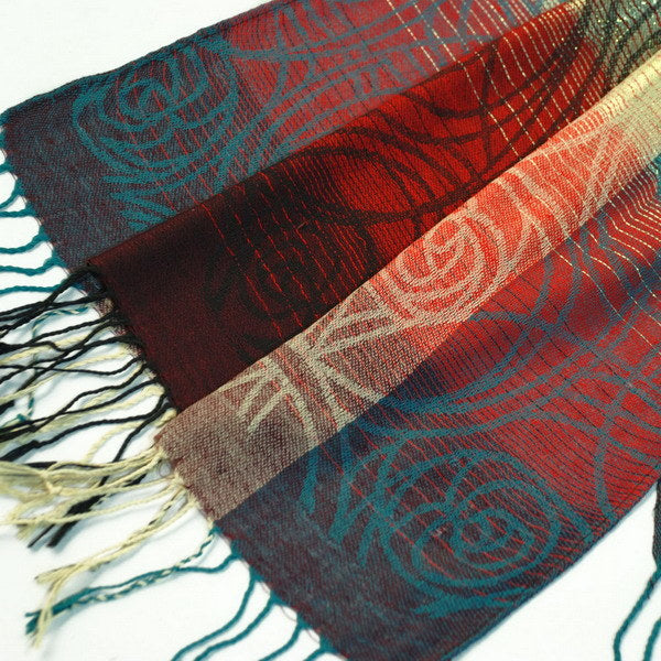 Blancho Bedding pashmina shawl close-up with tassels and teal, red, cream scroll motifs