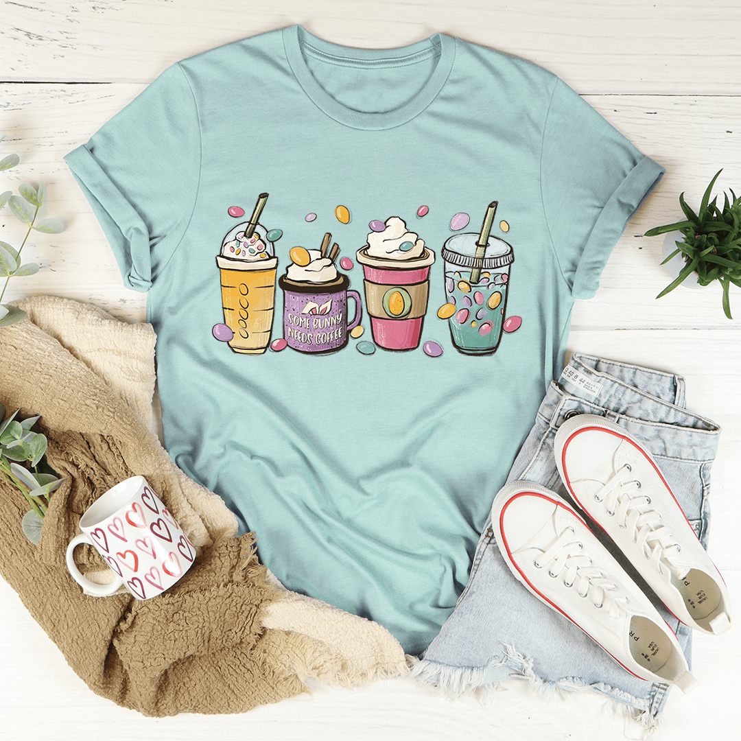 Light teal crew-neck T-shirt front view with colorful Easter bunny coffee drink graphic