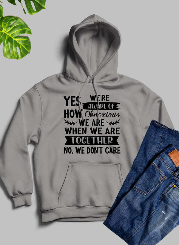 Heather gray hoodie with kangaroo pocket and bold white slogan graphic, hooded