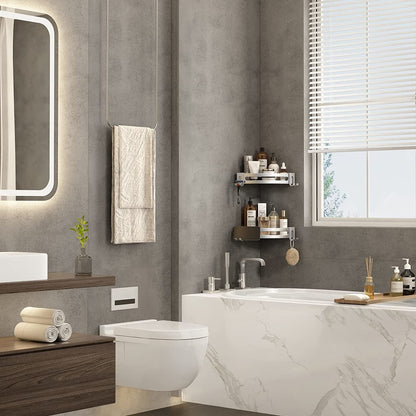 Silver corner shower shelf caddy with two curved tiers for toiletries
