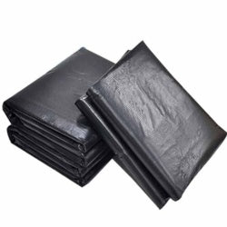 Black trash bag liners, folded stack.