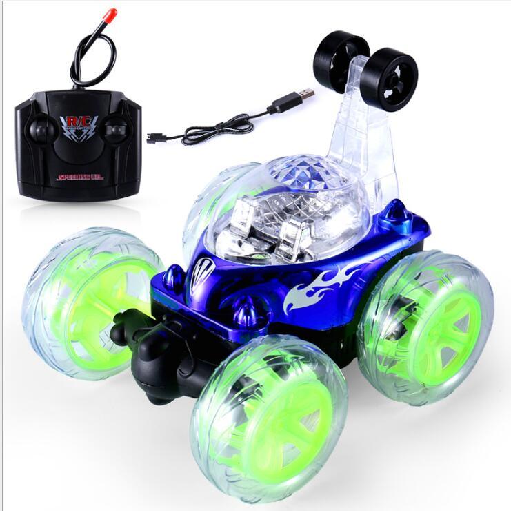 Mini RC stunt dump car with blue body, translucent green wheels, and black remote controller