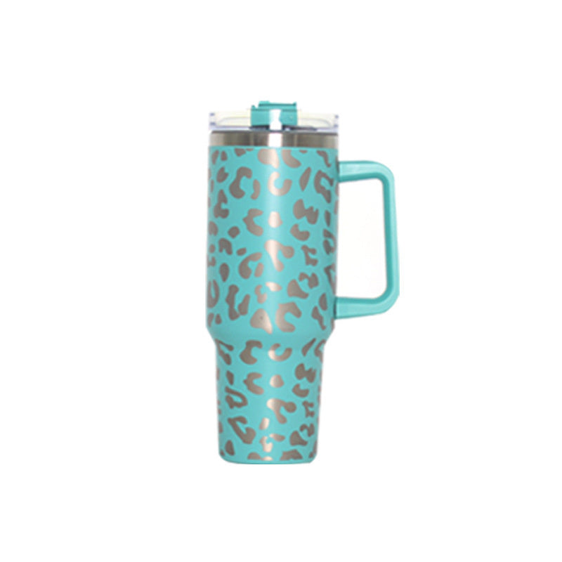 Mint leopard-pattern travel tumbler with handle and clear lid, straw-ready