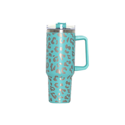 Mint leopard-pattern travel tumbler with handle and clear lid, straw-ready