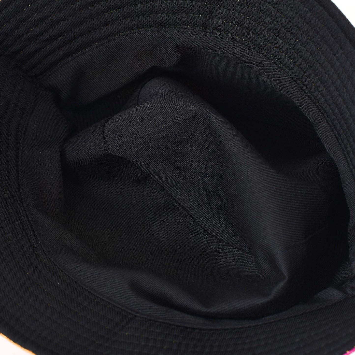 Black bucket hat interior view with dark fabric lining and seam stitching