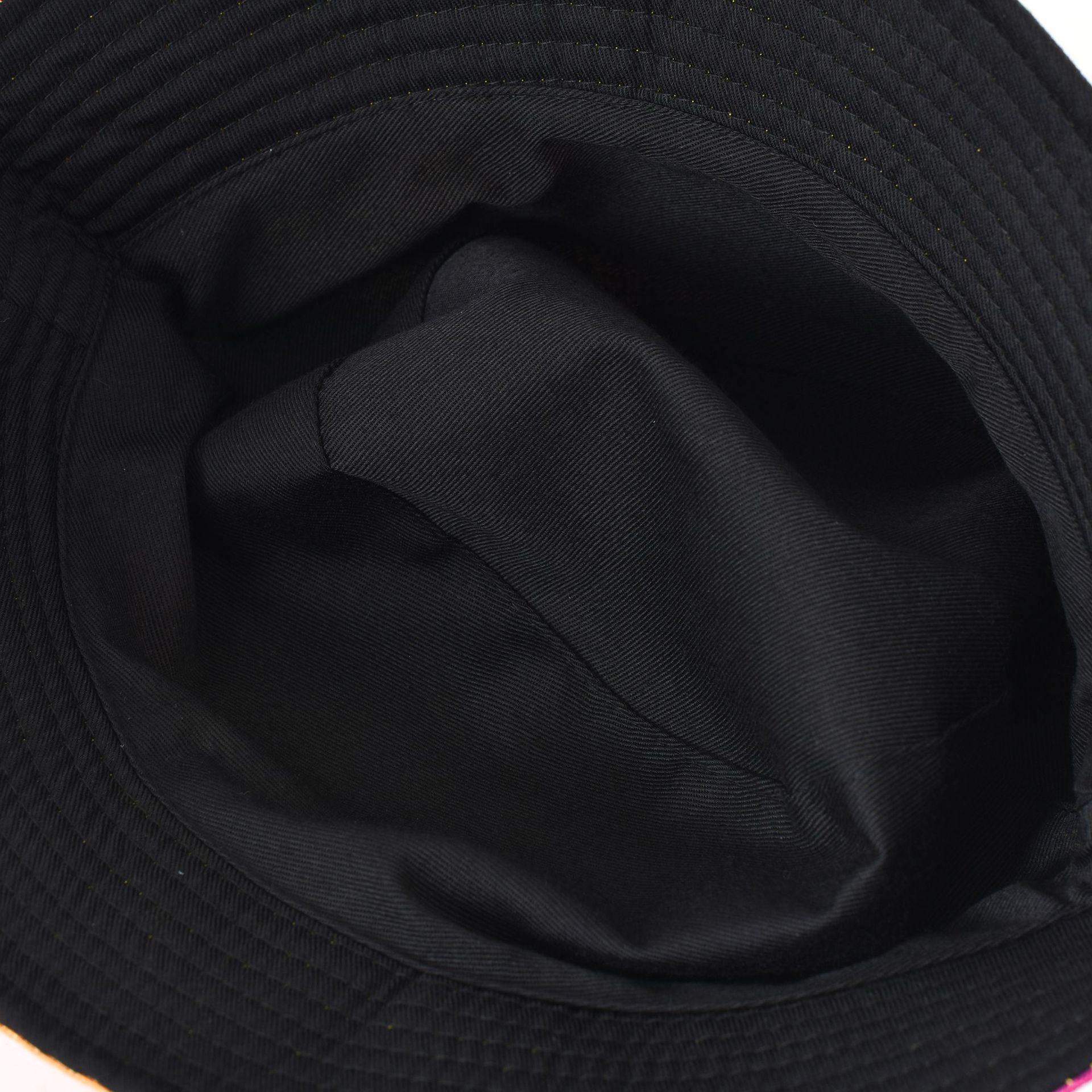 Black bucket hat interior view with dark fabric lining and seam stitching