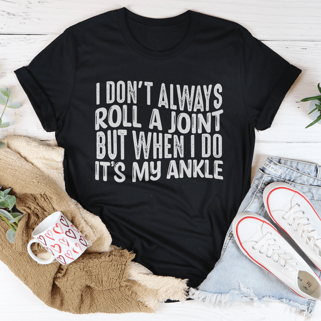 Black crewneck T-shirt with white centered 'I don't always roll a joint' text graphic