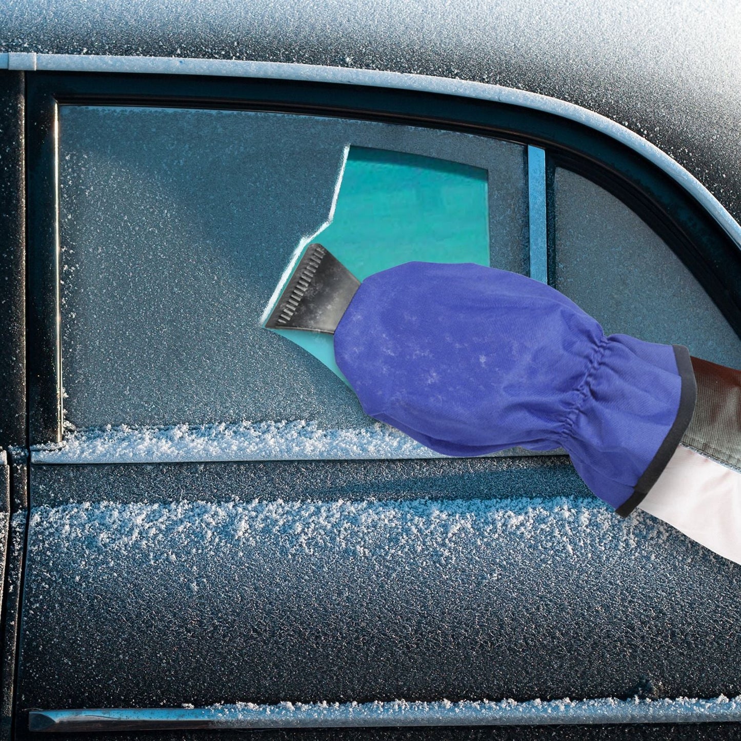 Purple ice scraper glove clearing snow from car windshield with black blade