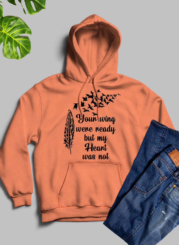 Orange pullover hoodie with front pocket and feather graphic text design on chest