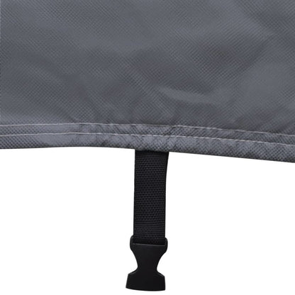 Gray caravan cover securing strap with buckle at the bottom hem