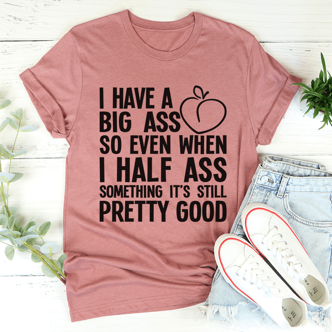 Mauve crew-neck T-shirt with black quote text and heart graphic on front