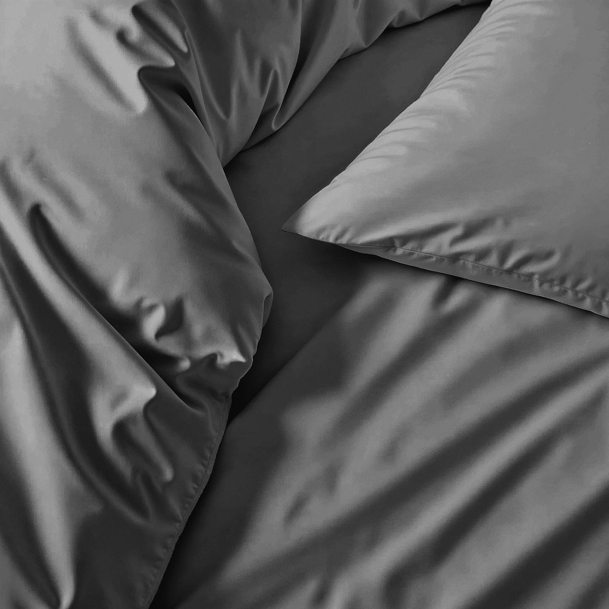 Gray sateen pillowcase set with smooth fabric and stitched edge detail
