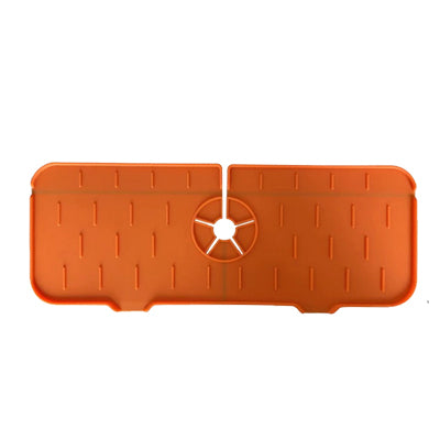 Orange kitchen faucet mat with raised drip tips and circular drain center