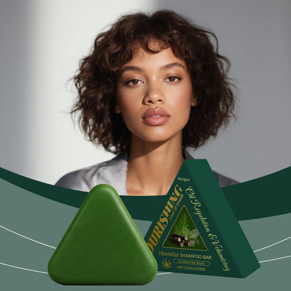 Green triangle shampoo bar with herbal label, angled view