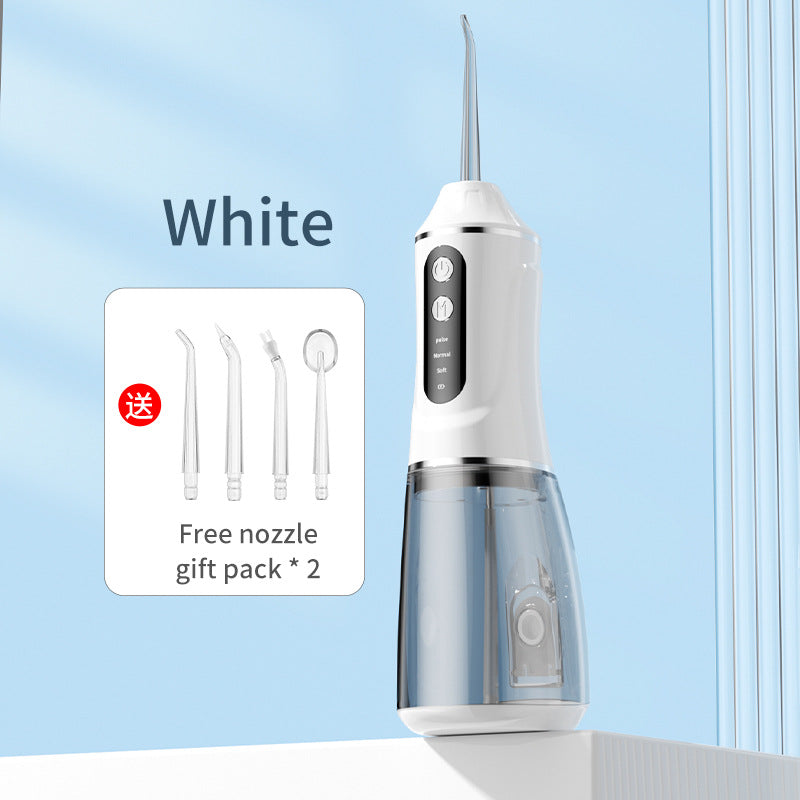 White portable electric dental flosser with free nozzle gift pack shown