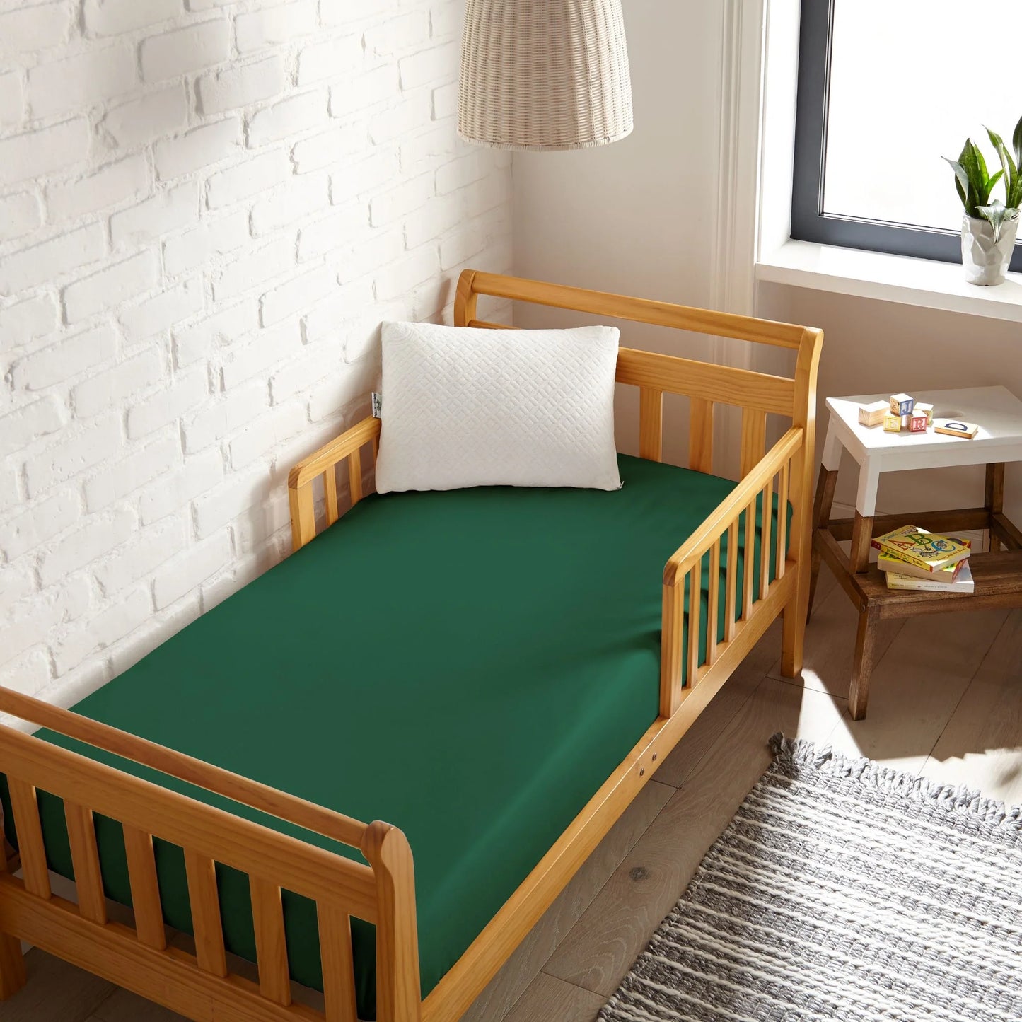 Crib fitted sheet in deep green, smooth knit fabric for crib mattress