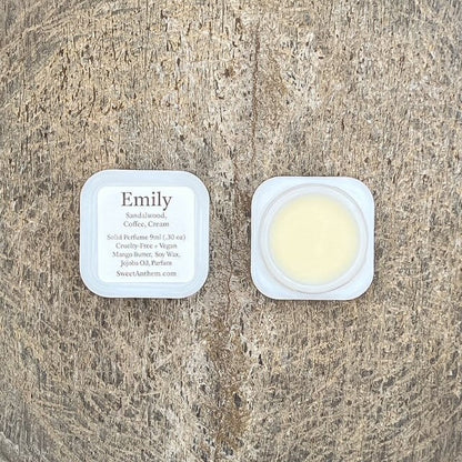 Emily scented balm containers, one labeled and one open with pale cream inside